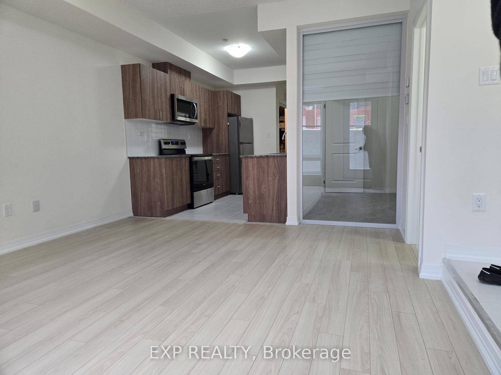 Experience modern living in this never lived in ground floor stacked townhome !