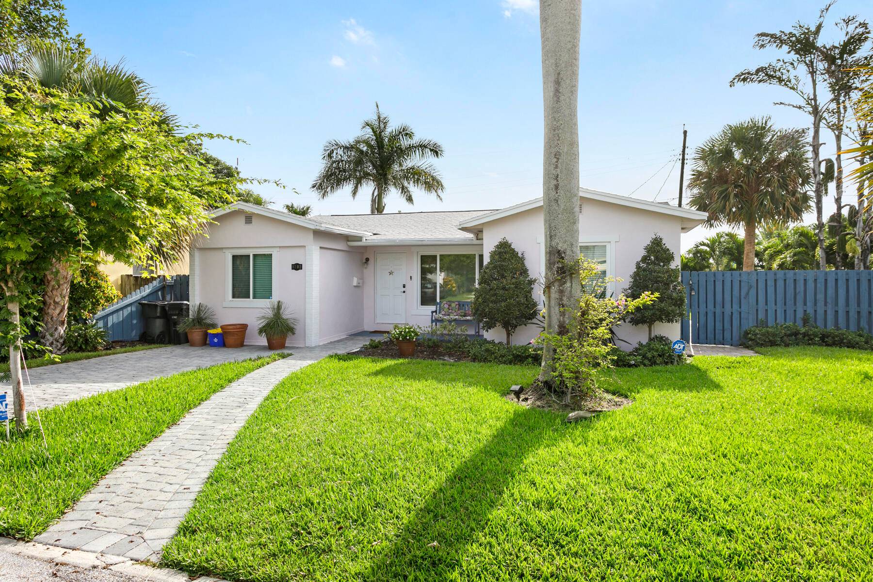 Wonderful renovated 3 bedroom, 2 bath home with lush landscaping, salt water pool, and large patio all on a quiet Lake Worth Beach street.