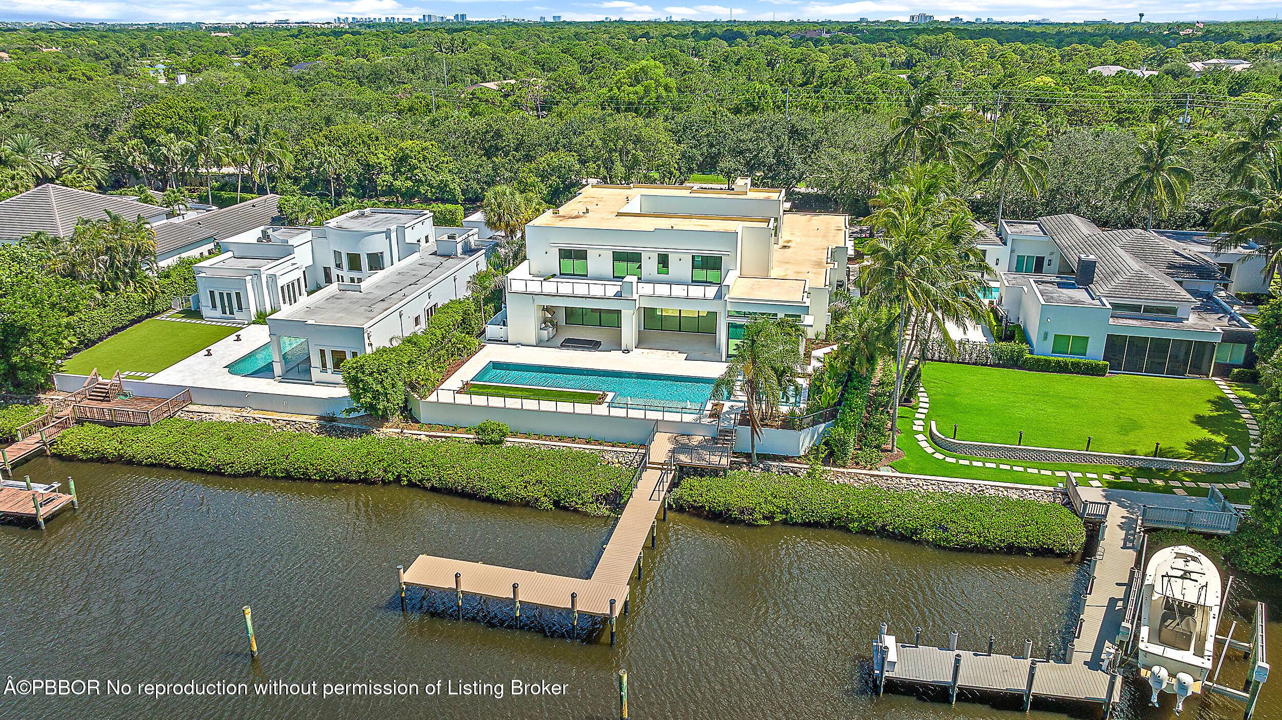 Welcome to 410 Mariner Drive, a contemporary waterfront masterpiece in the prestigious enclave of Admirals Cove.