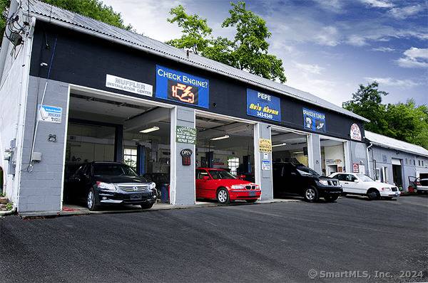 Successful auto body auto repair shop with affluent customer base for sale, including real estate.