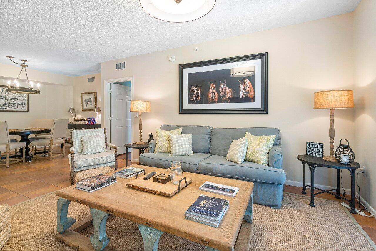 Perfectly updated and private ground floor condo, with one garage and two driveways attached to breeze way across from unit entrance.
