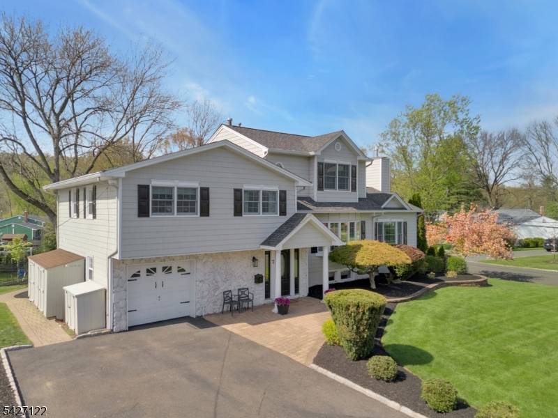 Set in one of New Providence's most sought after neighborhoods, this impeccably maintained 4 bedroom, 3.