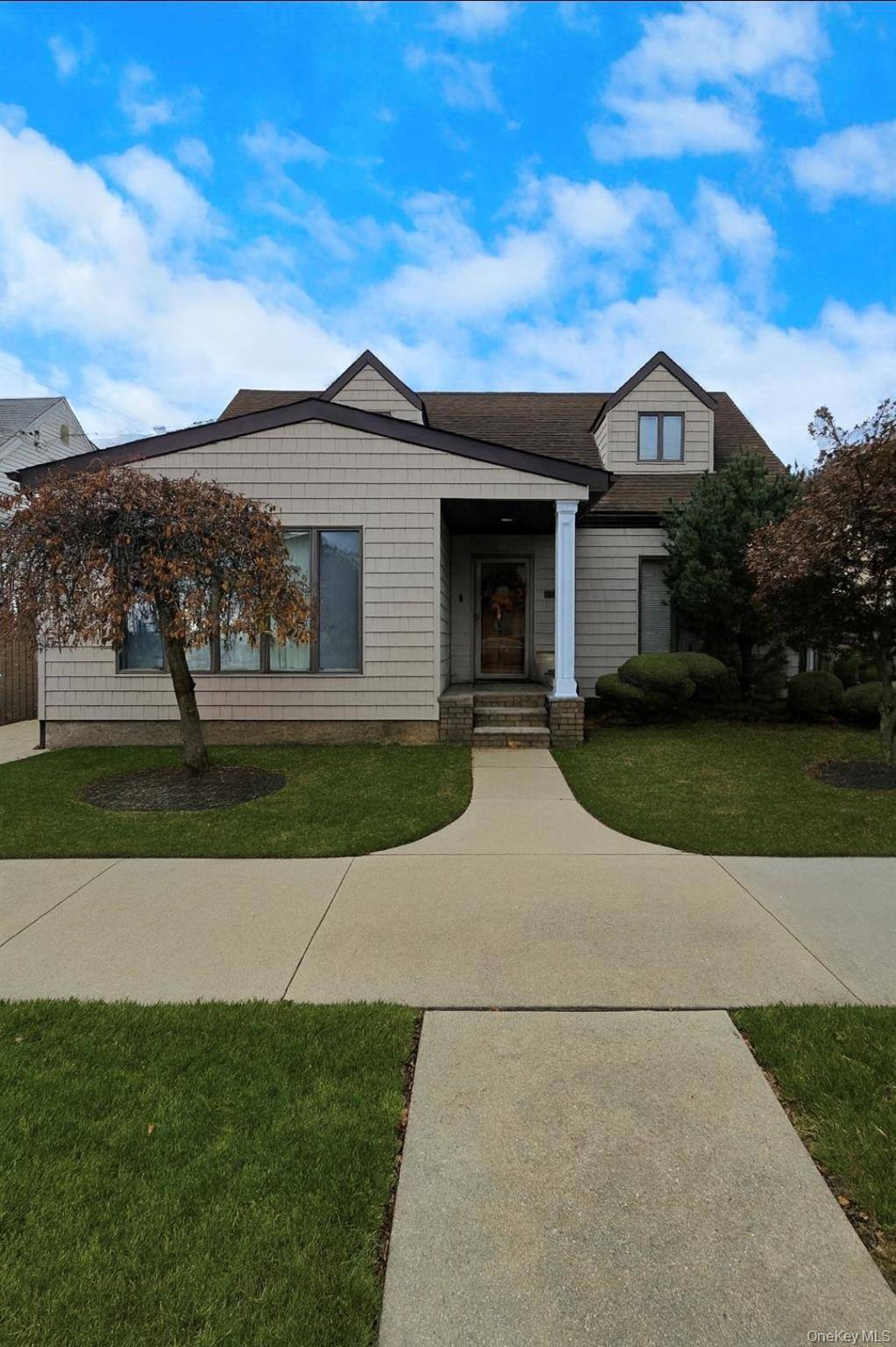 Welcome to this impeccable extended cape, where classic craftsmanship meets beautifully curated interiors on an oversized 50x100 lot.