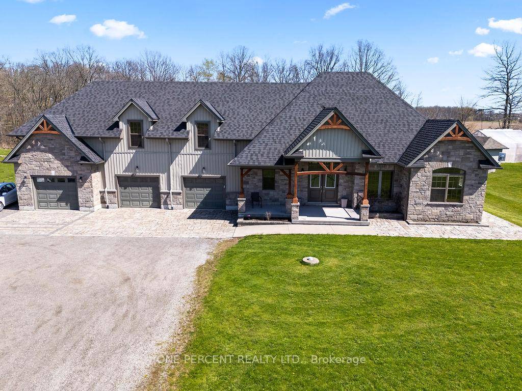 Welcome to 3265 Mountain Road a beautifully maintained bungalow with an attached 3 car garage and a 1 bedroom GUEST OR IN LAW SUITE above the garage, with approximately 5.