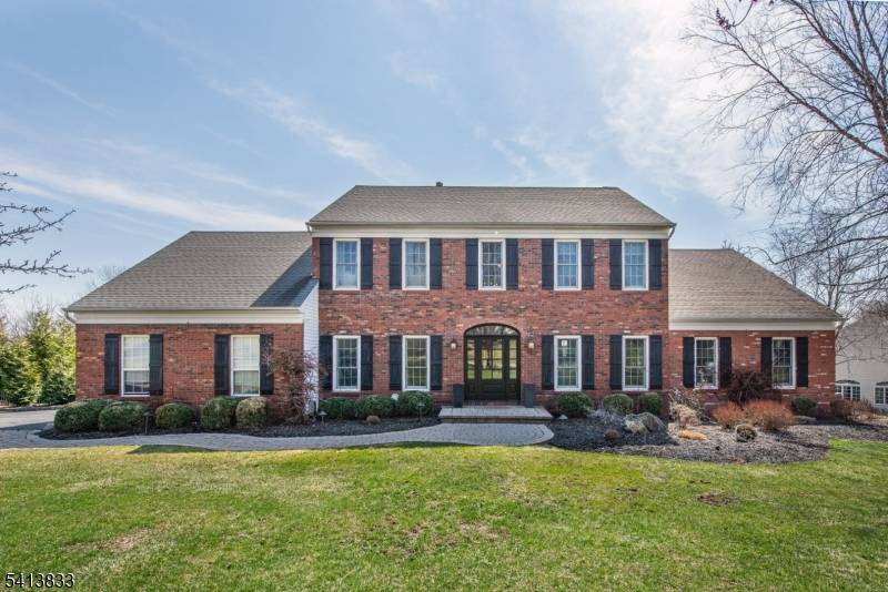 An exceptional Toll Brothers brick front 5 Bedroom Colonial on a premier cul de sac in Mount Olive's sought after Green Hills neighborhood has just come to the market !