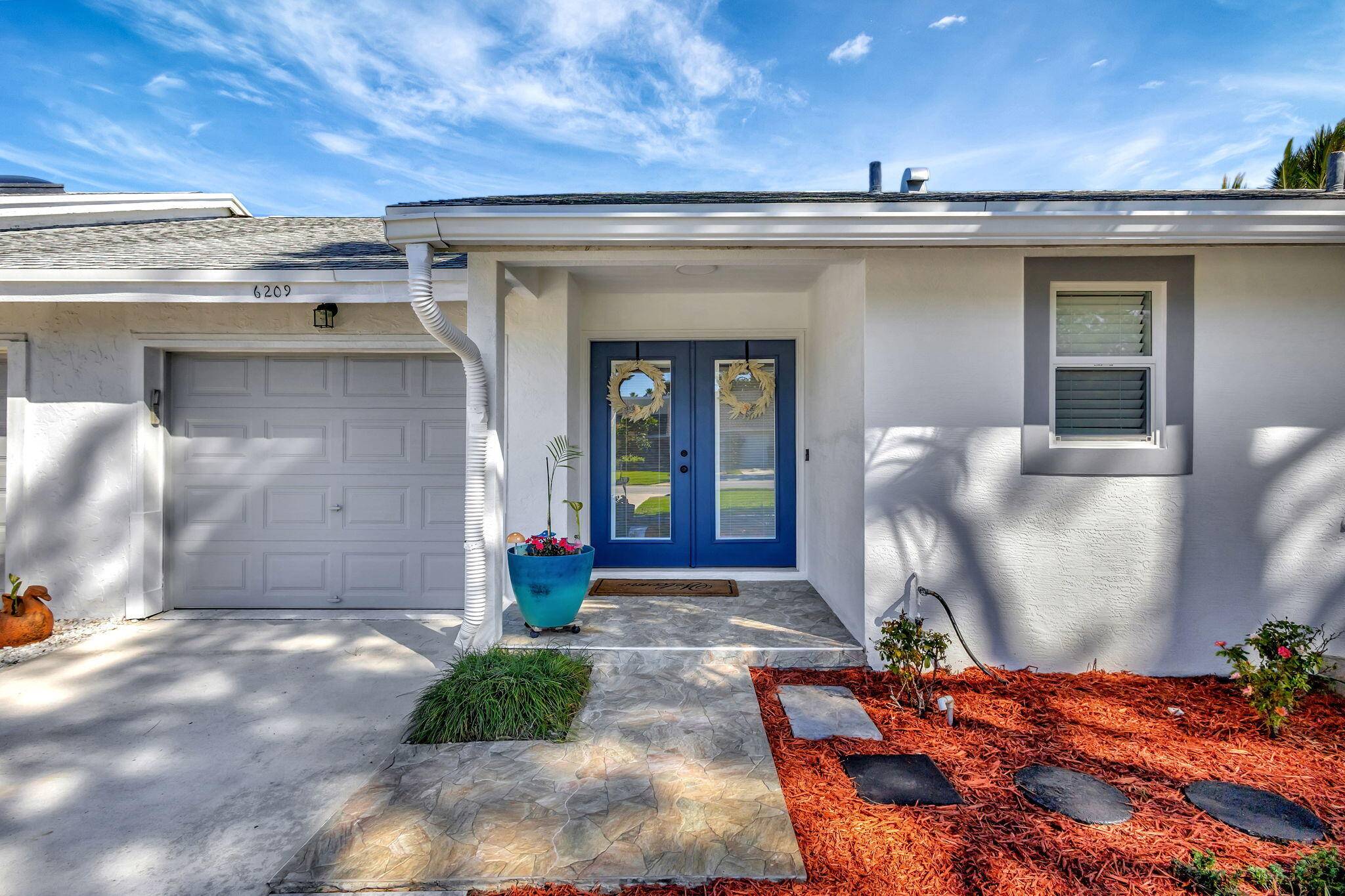 Make this your home ! Beautifully renovated throughout with 2 spacious BR 2 modern bathrooms, impact windows with amazing view of the newly renovated 18 hole Fazio golf course.