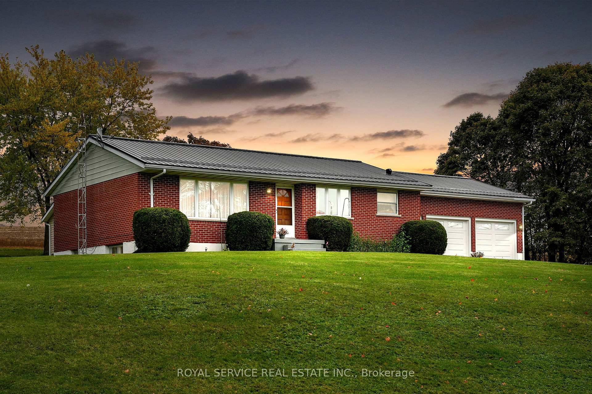 Discover the perfect blend of country tranquility and town convenience with this brick bungalow, set on a beautifully maintained large lot just minutes from Cobourg.