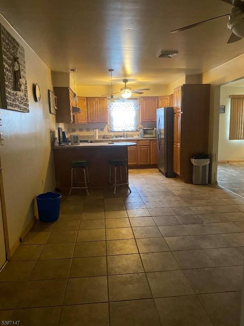Well maintained 3 bedroom, 1 bath ranch featuring a spacious living room with sliding doors that open to a large deck perfect for entertaining.