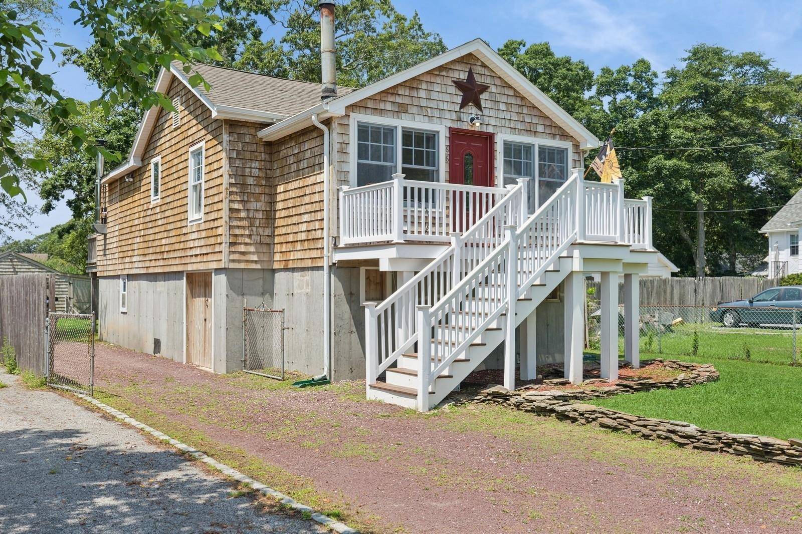 Set on two tax lots and bordered by preserved state land, this elevated 3 bedroom, 1 bathroom raised ranch is ideal for boaters, entertainers, or anyone seeking a relaxed coastal ...