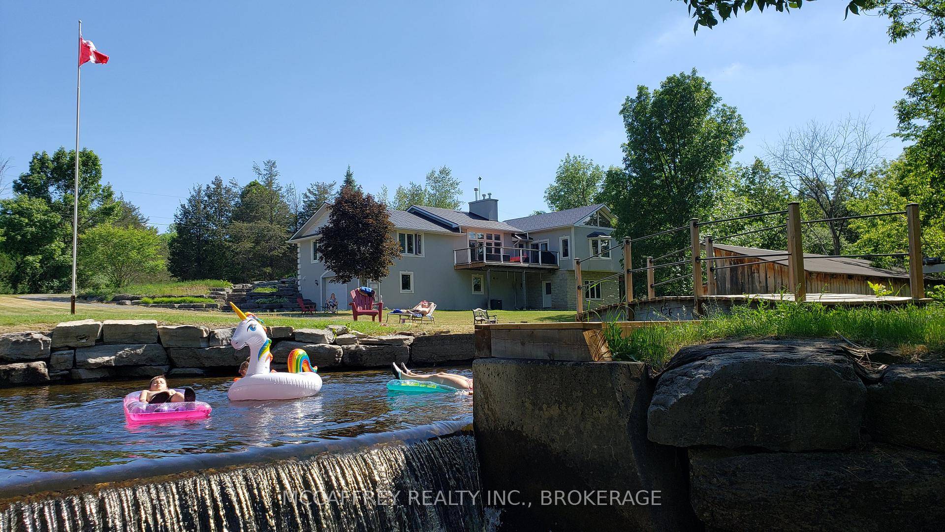 WATERFRONT ESTATE ON 25 ACRES FEATURING THE MAGNIFICENT FOREST MILLS FALLS AND HISTORIC WATER POWERED SAWMILL.