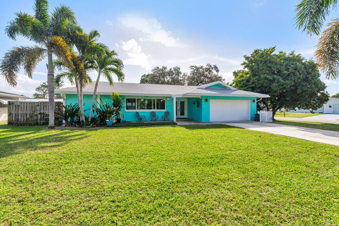 Situated on a quiet street within a highly desirable non HOA neighborhood, this corner lot, single family home sits in the heart of Palm Beach Gardens.