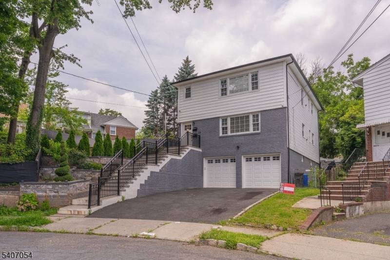 Nestled in a quiet cul de sac in the heart of Maplewood, this beautifully renovated two family home offers modern updates.