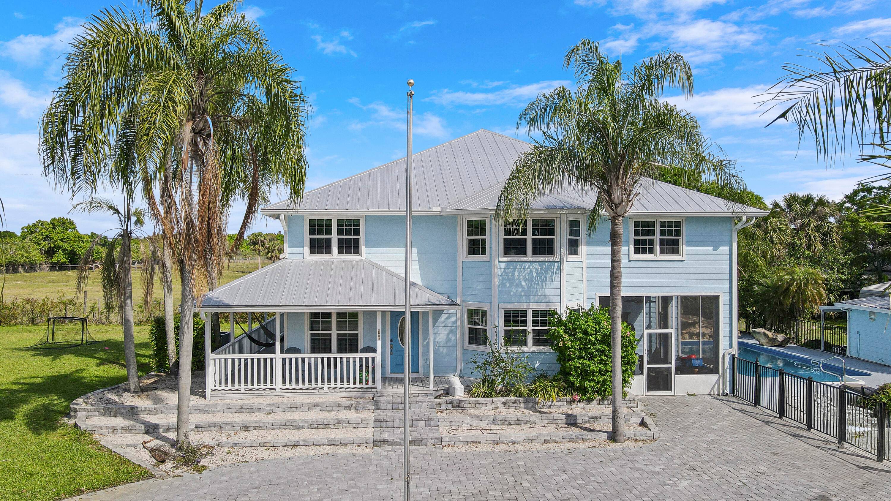 6 Bedroom 4 Bath pool home with 2 additional half baths and located on a huge 2.