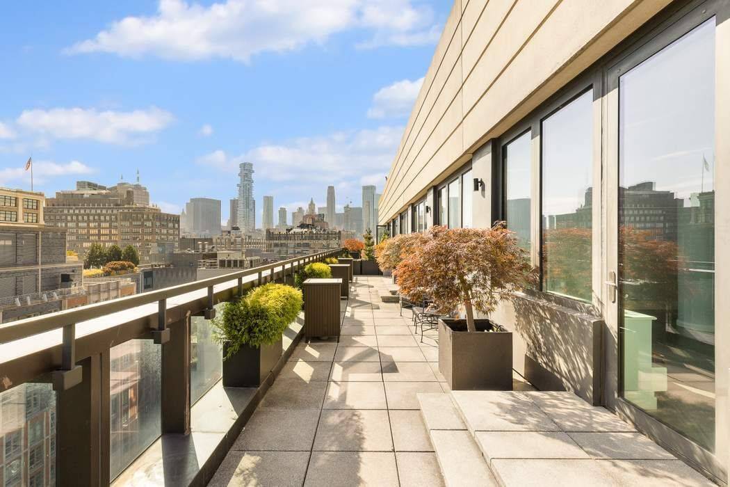 Exceptional West Soho Hudson Square Penthouse with dramatic city views and a 50ft long, private, landscaped terrace.