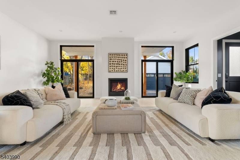 Unit B is a distinguished 4, 537 sf new construction featuring an open concept layout that seamlessly integrates the kitchen, dining, and living areas.