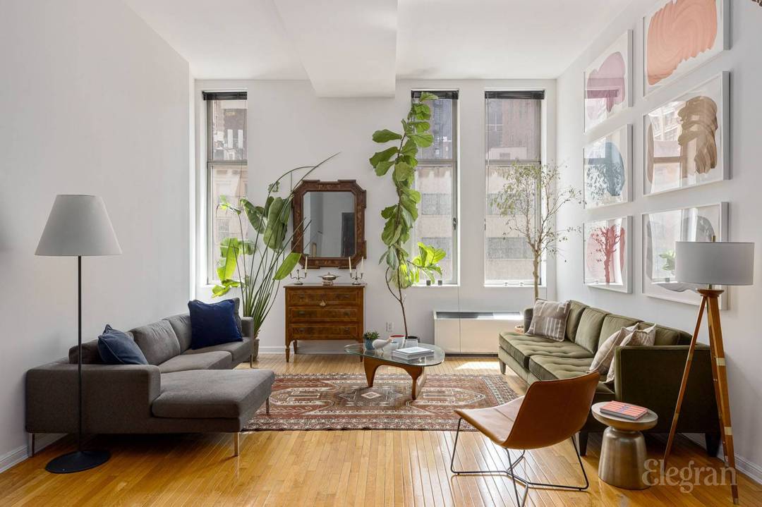 Now available on what is most likely the most coveted floor of the Chelsea Mercantile, this authentic loft residence features soaring 12.