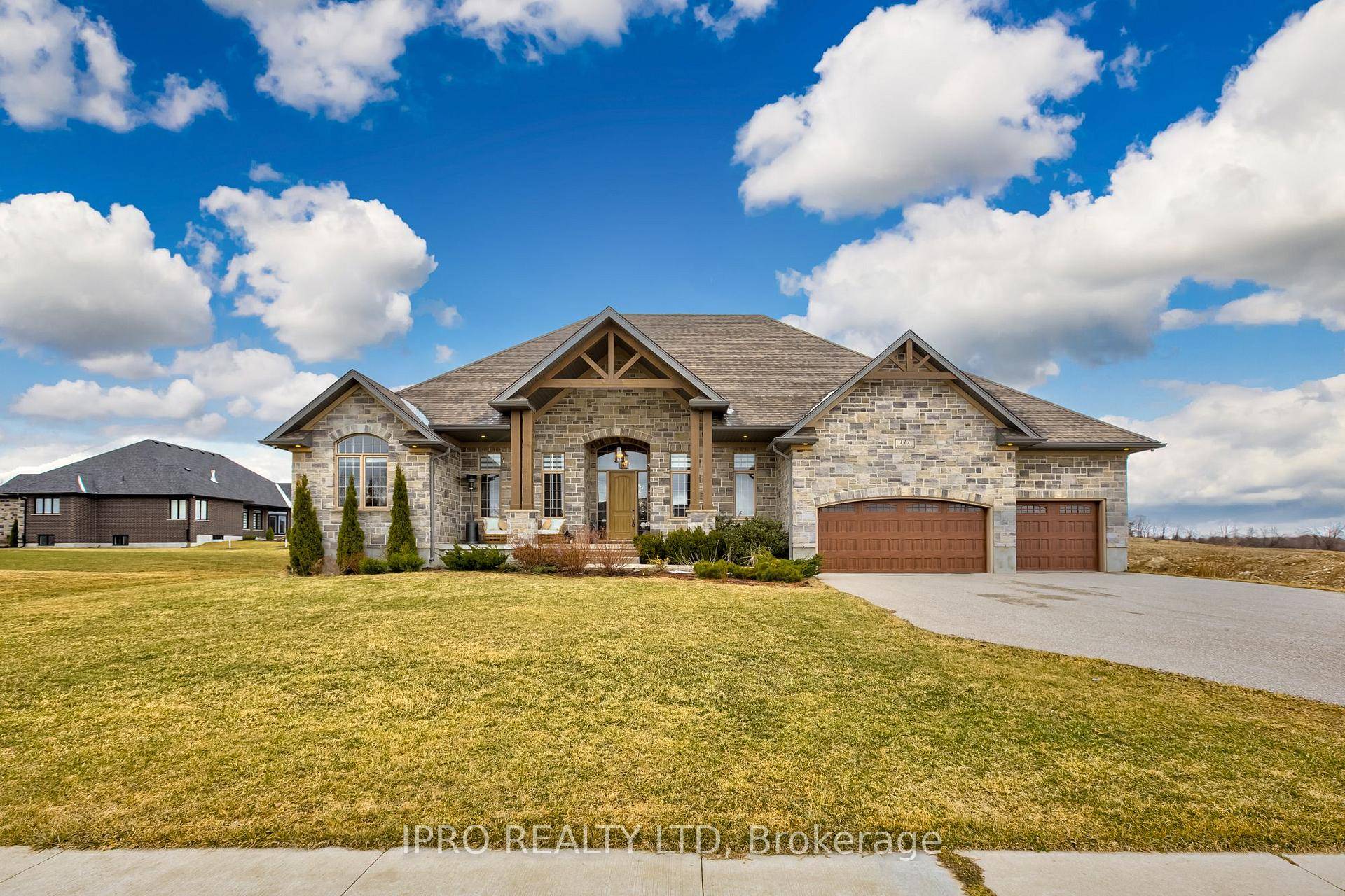 Welcome to this custom built stone brick Bungalow on a 1 2 acre end Lot, abutting a green farmland with beautiful, picturesque surroundings in the lap of nature.