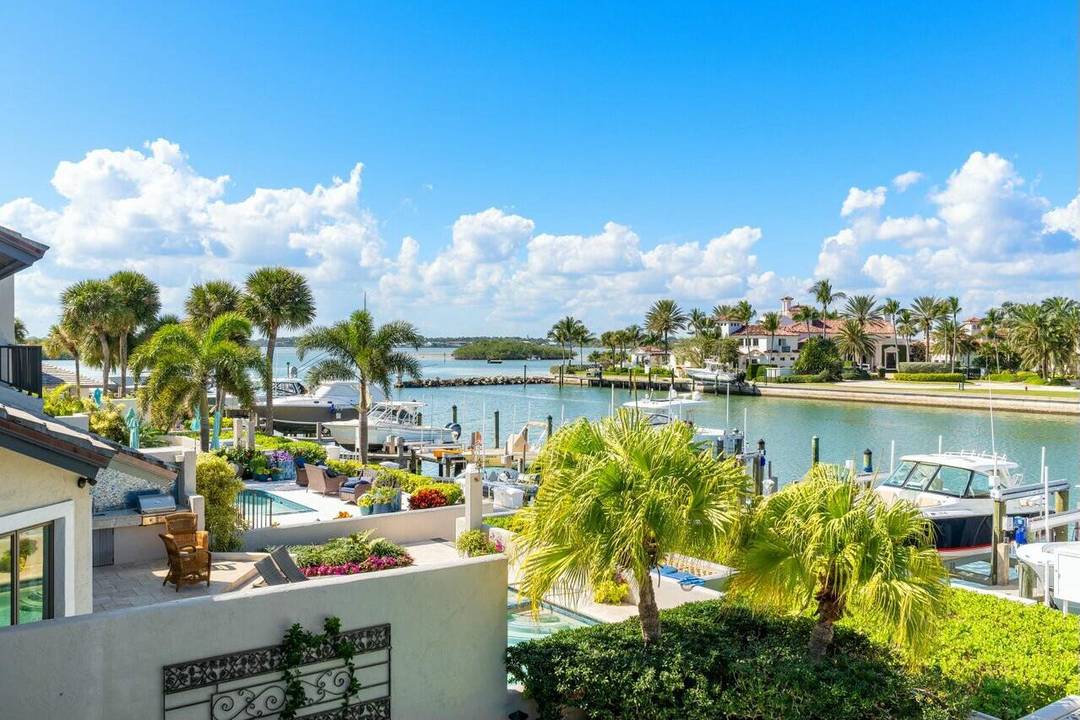 Elegant corner townhouse with sweeping waterfront views !