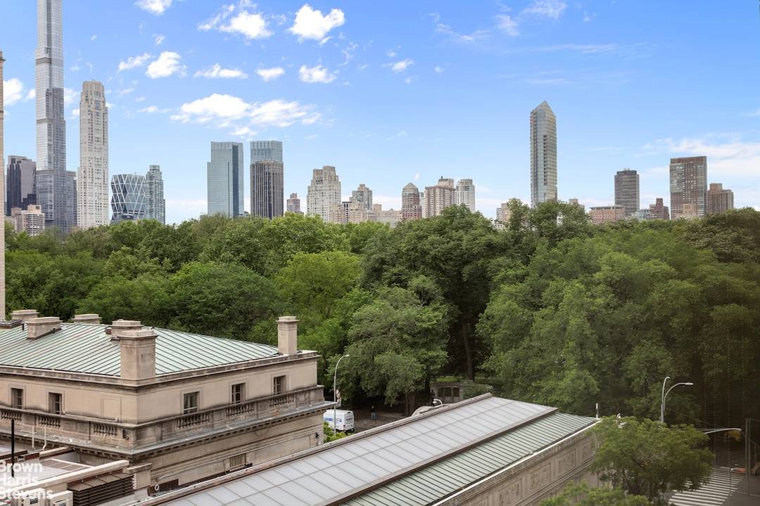This spacious light filled three bedroom plus open library duplex enjoys soaring views over the Frick and Central Park from all major rooms.