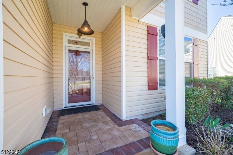 Dont miss this beautifully designed 3 bedroom 3 bath home featuring a bright open layout enhanced by rich hardwood flooring throughout much of the main level a private office and ...