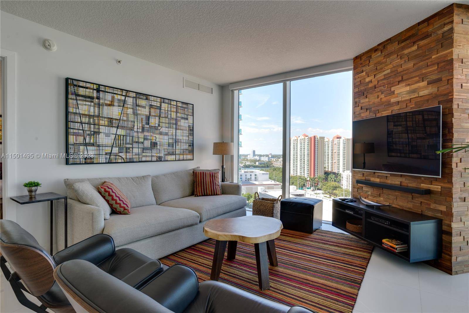 Stunning modern 3 bedroom, 2 bathroom corner unit featuring a gorgeous city and partial ocean view.