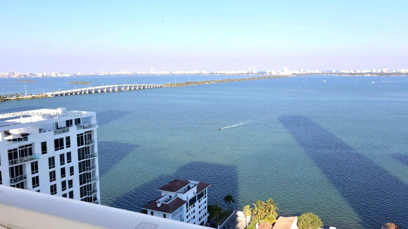 This Penthouse style unit captivates with breathtaking views of Biscayne Bay and the enchanting Ocean.