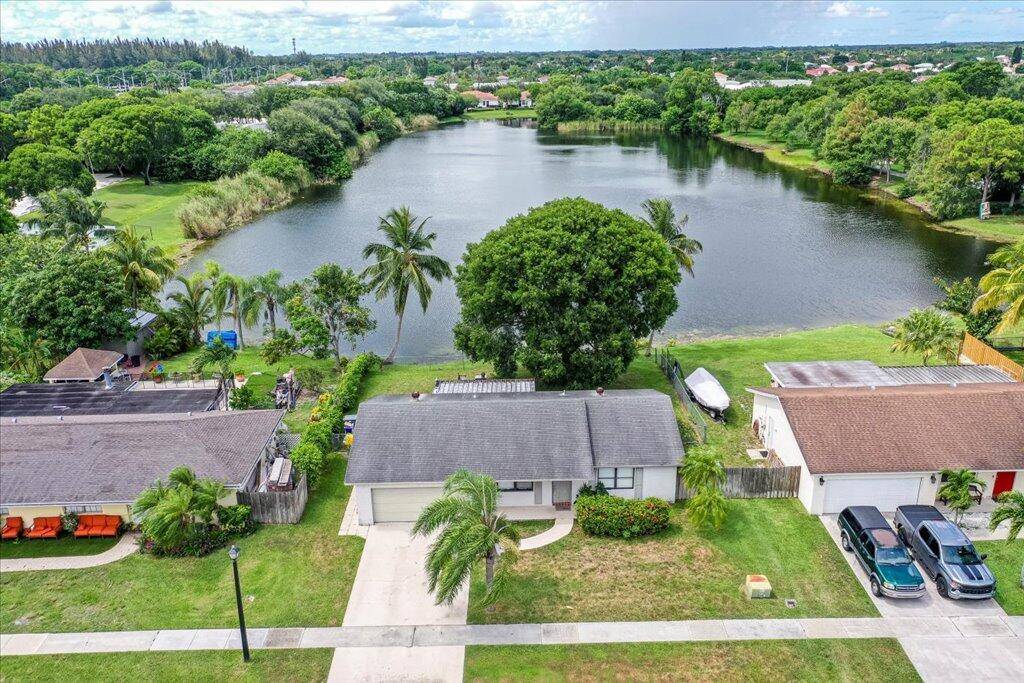 Charming 2 bedroom 2 bath home with an open floor plan, large backyard and a peaceful lake view located just steps from the community park.