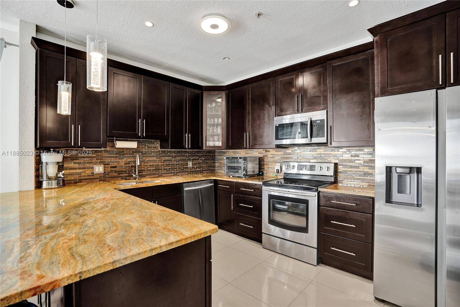 Discover your dream home in this stunning 3 bed, 2 bath first floor condo located in the beautifully maintained, gated Courtyards at Nautica community.