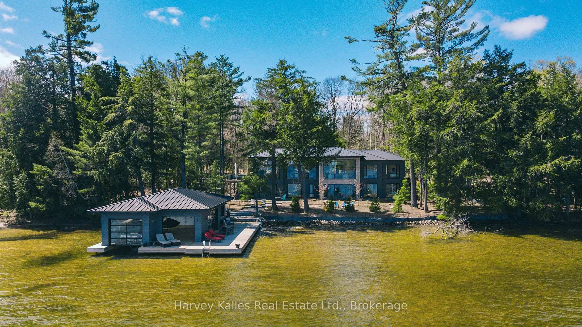 Spectacular contemporary beach cottage exquisitely addressed along the most coveted amp ; very rarely offered prime Port Carling to Port Sandfield corridor near to the MLG amp ; CC.