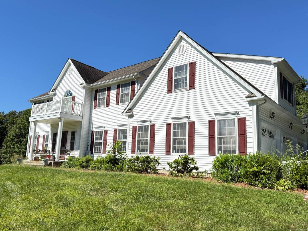 Set on a private 2 acre lot near Scoville Reservoir, this 4BR, 2.