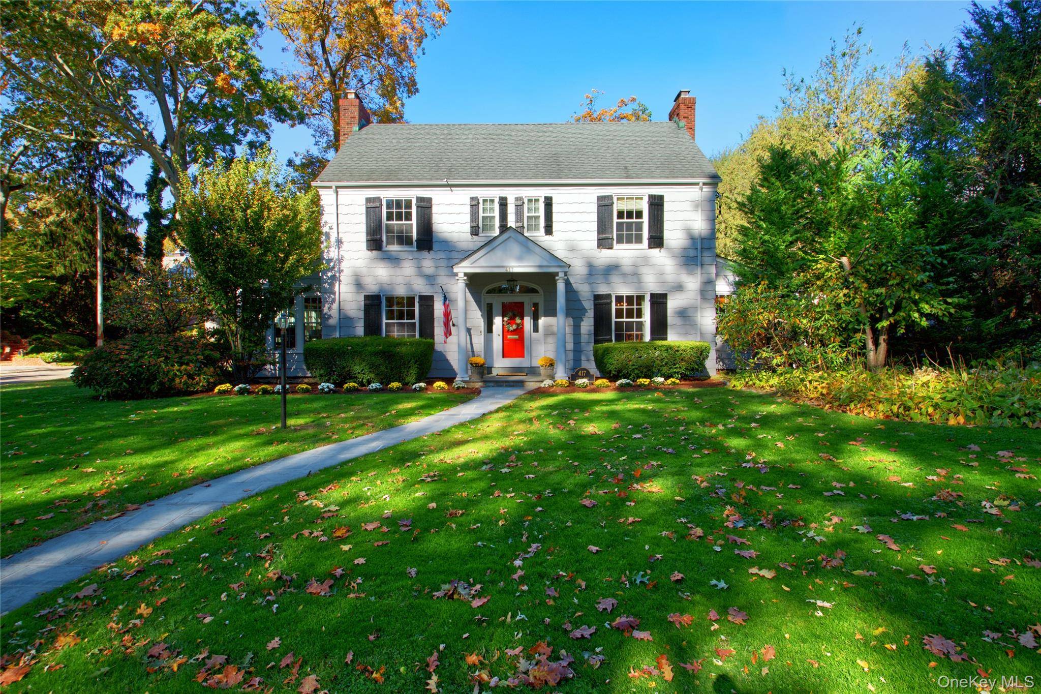 Step into this gracious home through a welcoming foyer that opens to an expansive living room with a wood burning fireplace, French doors, and an adjoining sun filled private office ...