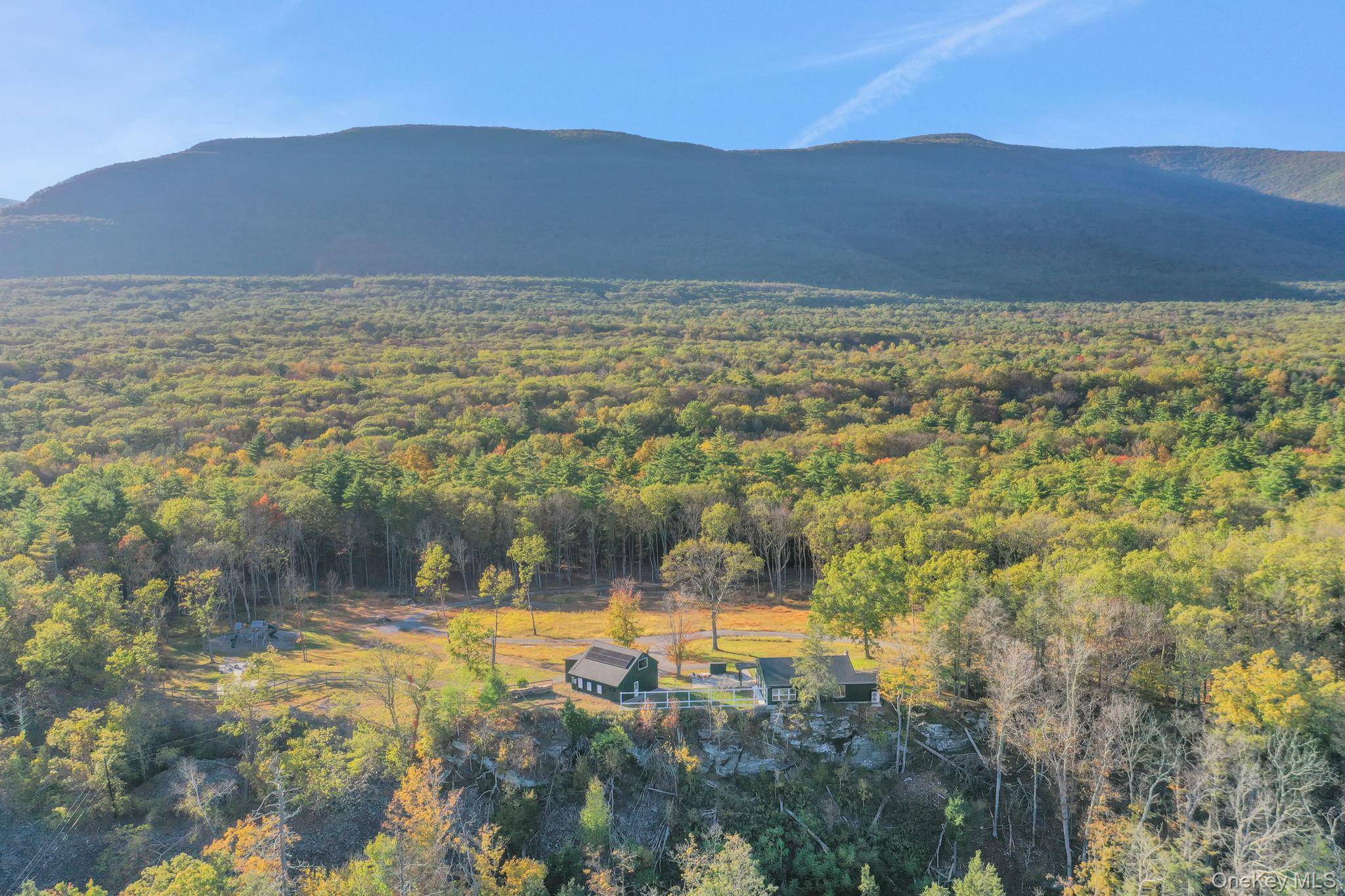 Complete privacy on ten beautiful acres with sweeping views of the Catskill Mountains in West Saugerties.