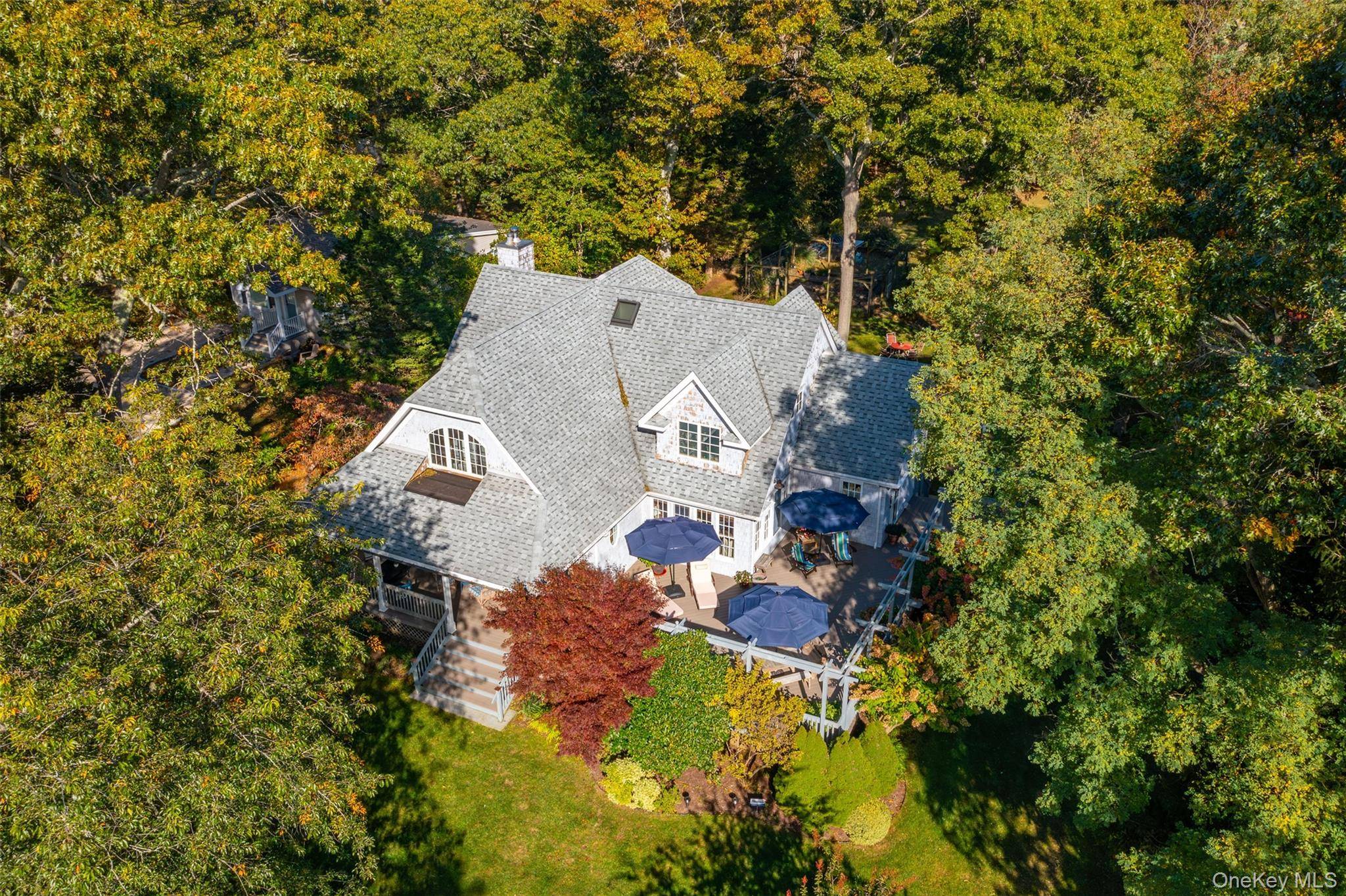 Stylish and comfortable home with plenty of space to relax indoors and out, featuring a covered porch, a sunny deck and a large yard.