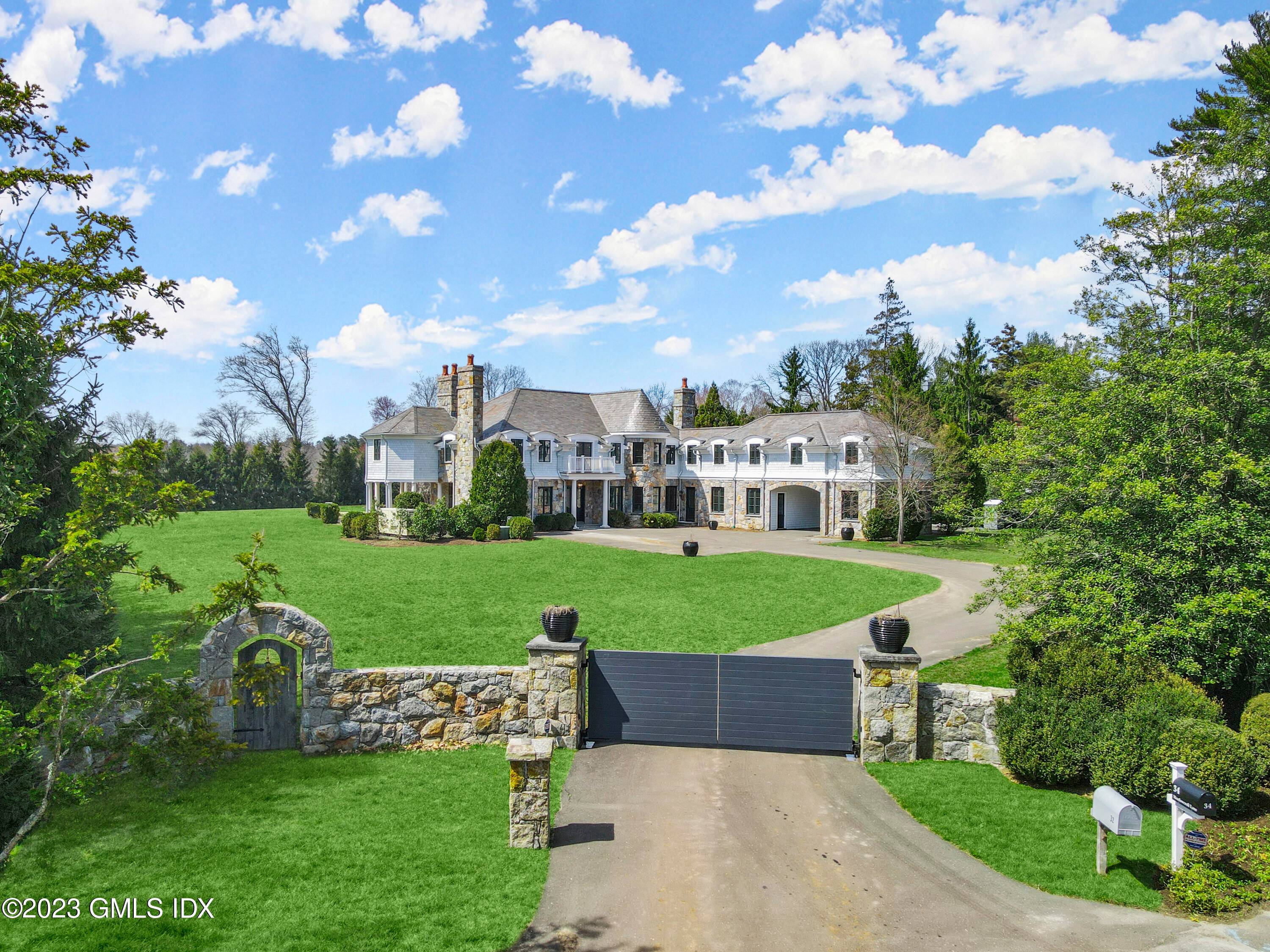 On a premier residential street in the heart of the Greenwich estate area sits a masterful residence on 2.