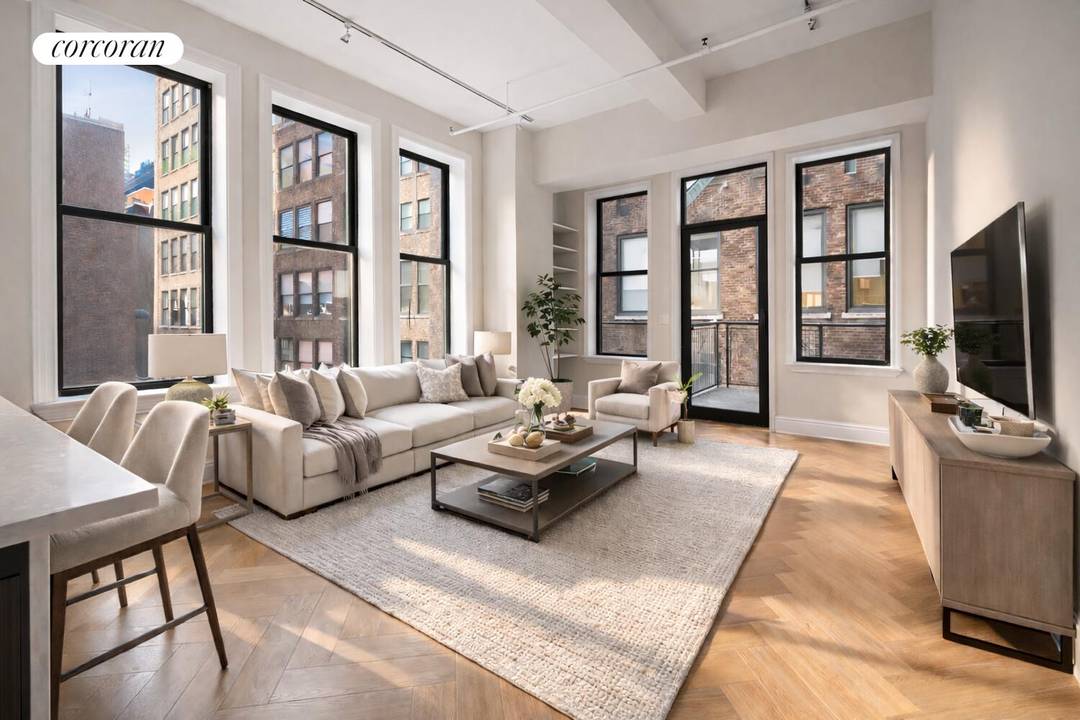 Welcome to Residence 8C at Park South Lofts a sun drenched corner home that seamlessly combines loft inspired character with modern sophistication.