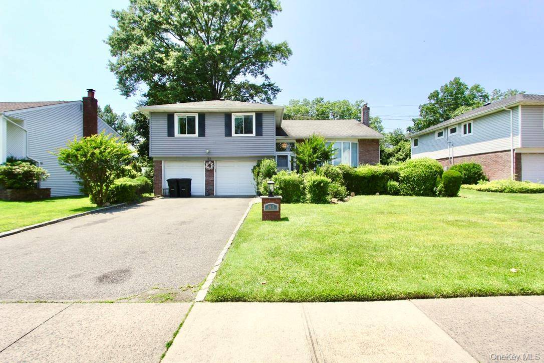 For rent in the heart of Manhasset Hills, this updated Hi Ranch home offers a perfect blend of modern upgrades and spacious living.