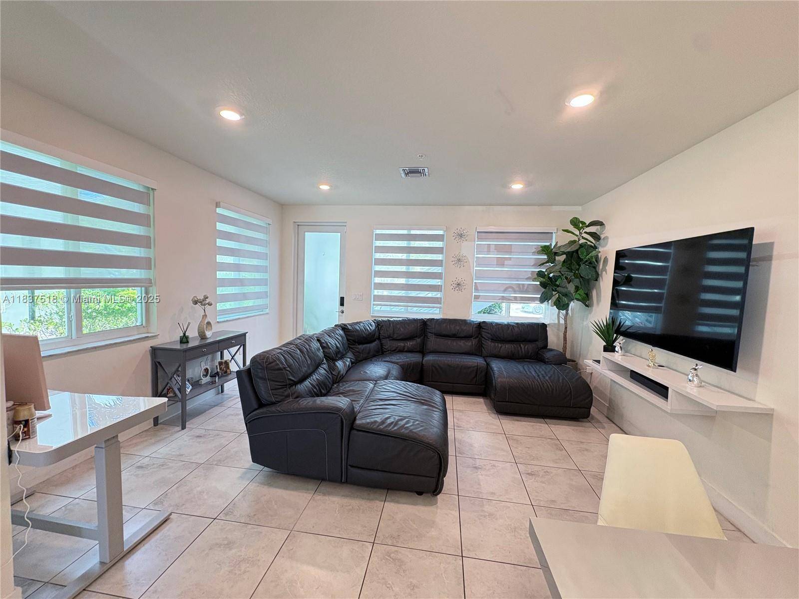 Welcome to this modern updated smart home in the heart of Doral, this beautiful townhouse offers 3 spacious bedrooms, 2.
