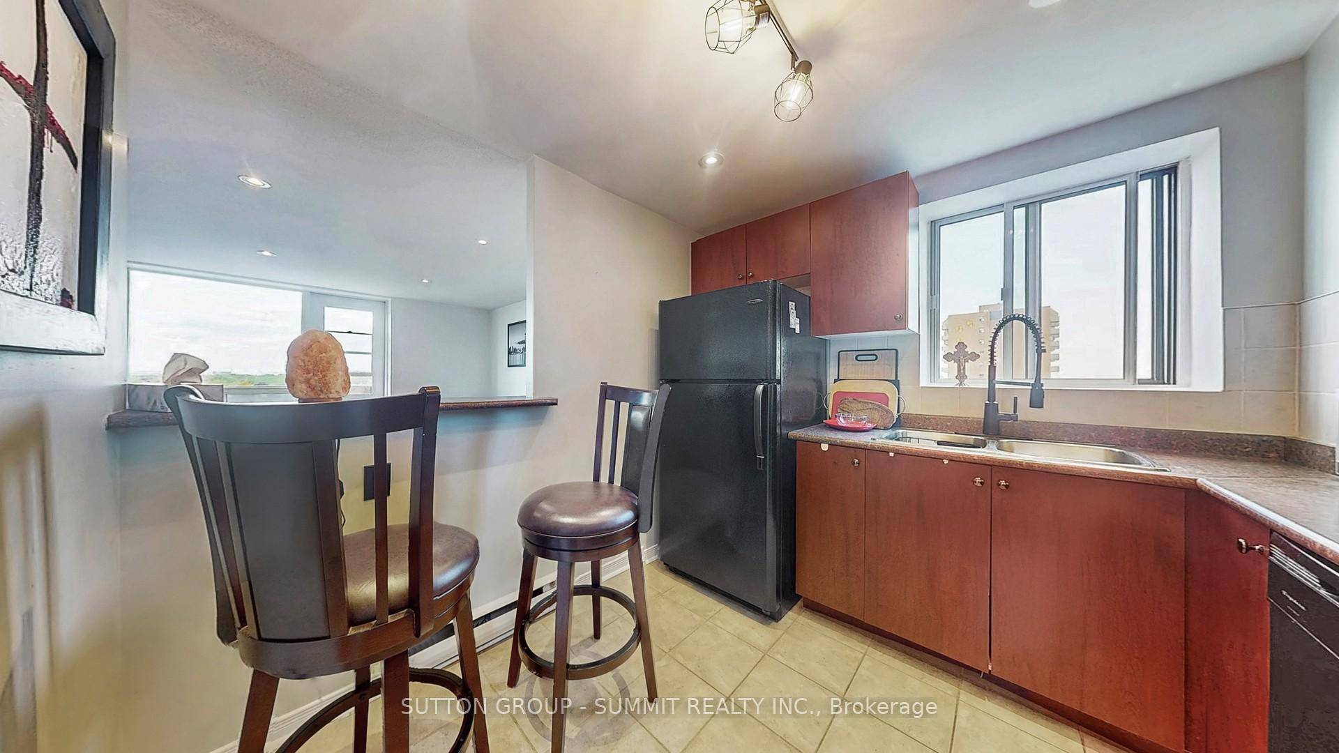 Affordable CORNER CONDO Family size KITCHEN WITH A WINDOW, lots of cupboards, counter space, extra electrical outlets for all your kitchen processors and a breakfast bar overlooking the living room ...
