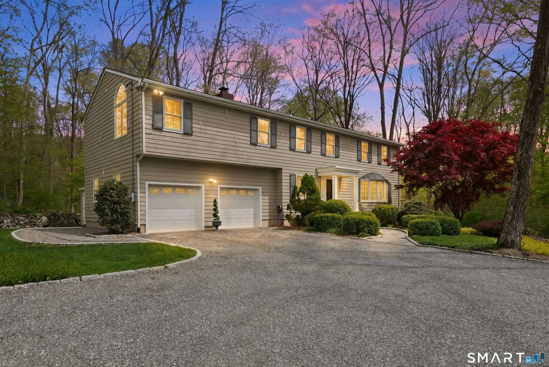 Your first impression ! A long dramatic driveway welcomes you to an entrance framed by professionally designed landscaping.