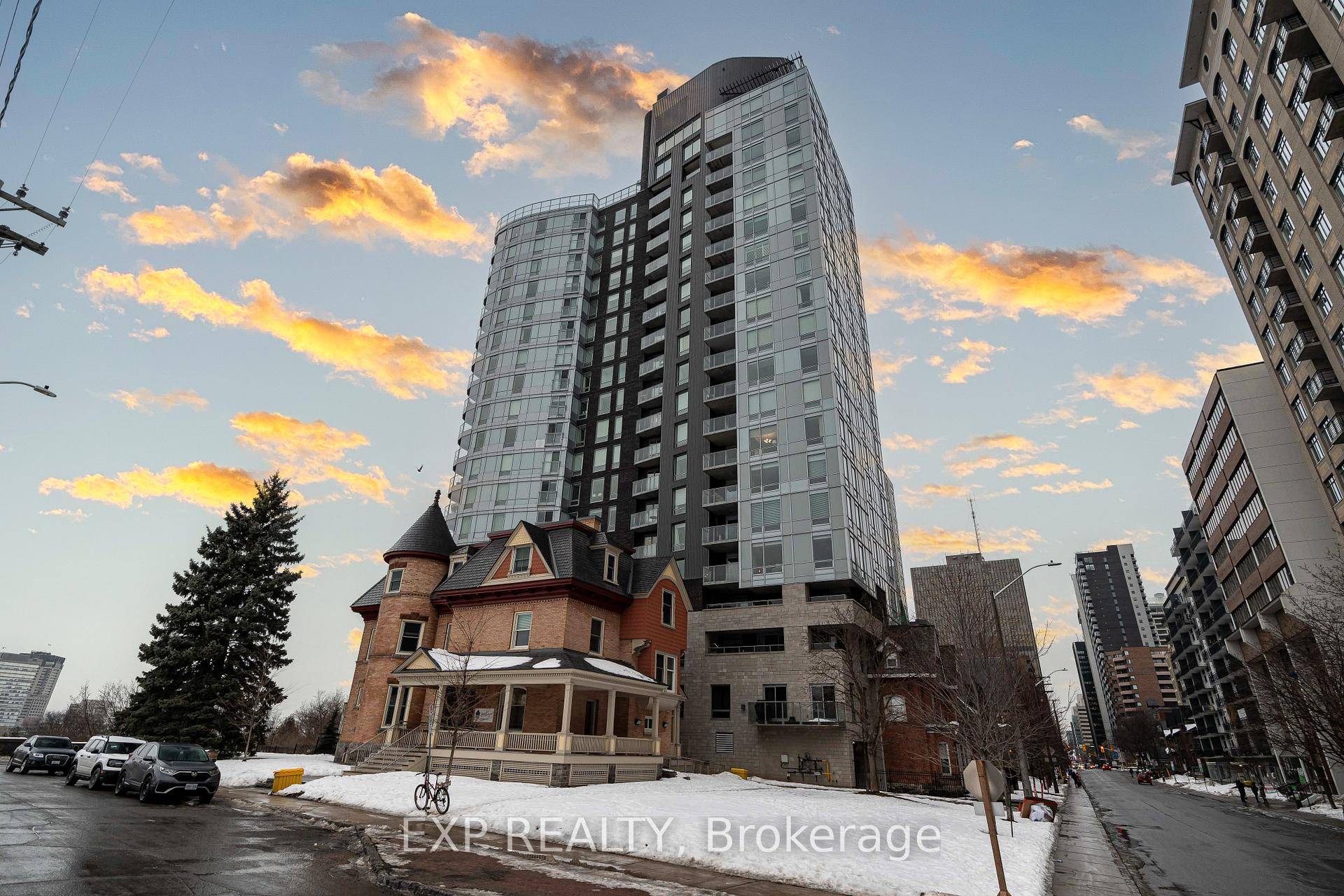 This corner unit apartment offers a bright, open concept layout, with a spacious bedroom, wall to wall closets, and floor to ceiling windows.