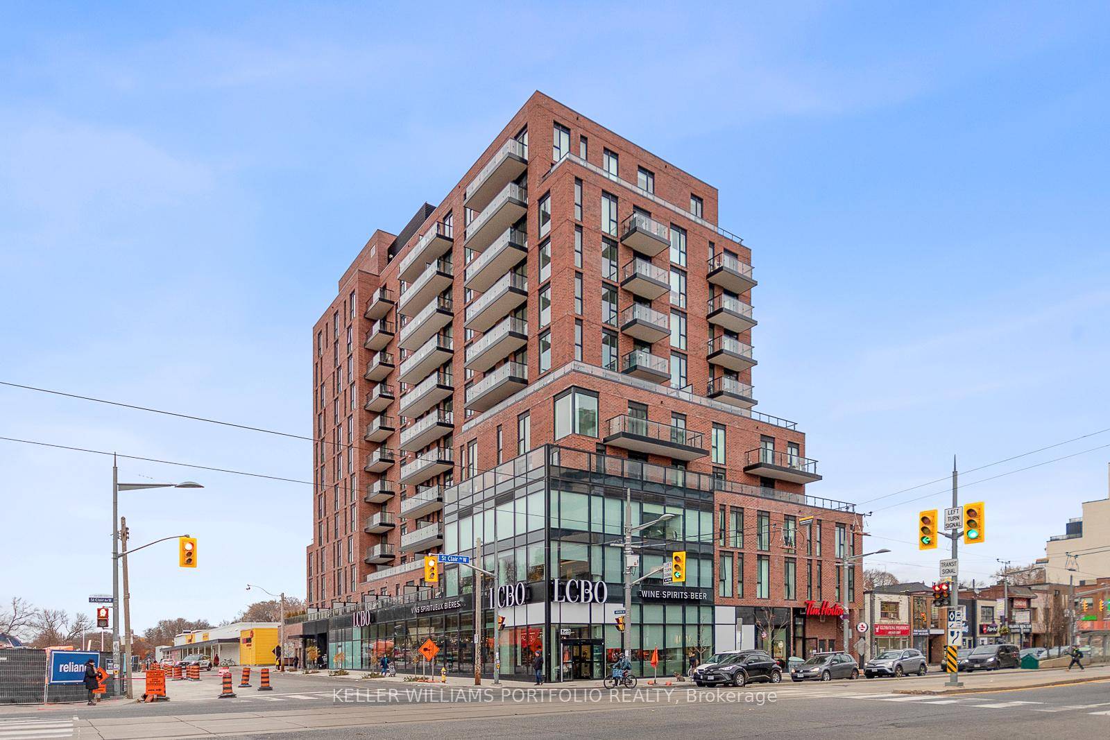 Spacious 2 bedroom, 2 bath open concept with a kitchen island.