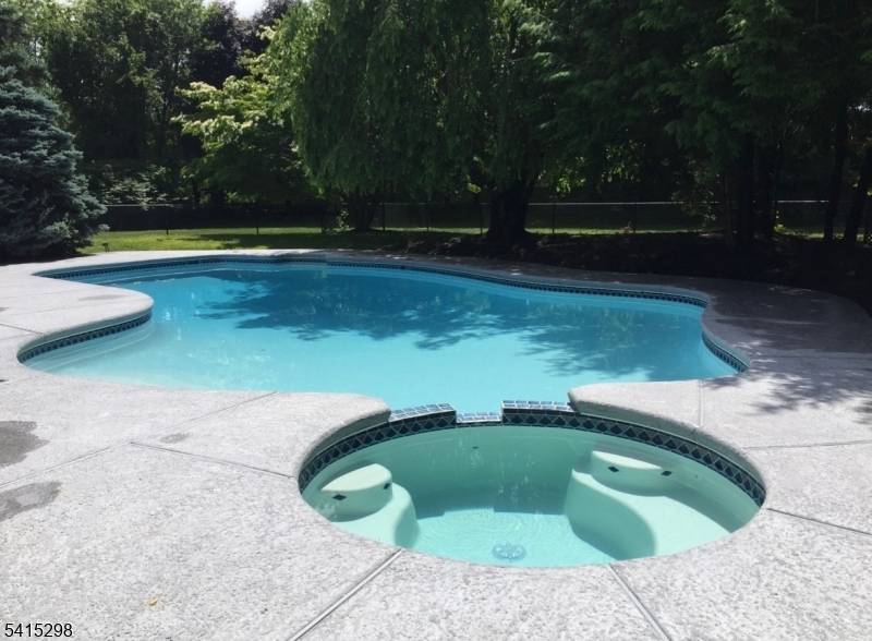 Set behind a long, private approach and surrounded by mature trees, this 4 bedroom, 4 bath residence offers a rare sense of seclusion, space, and light in one of Boonton ...