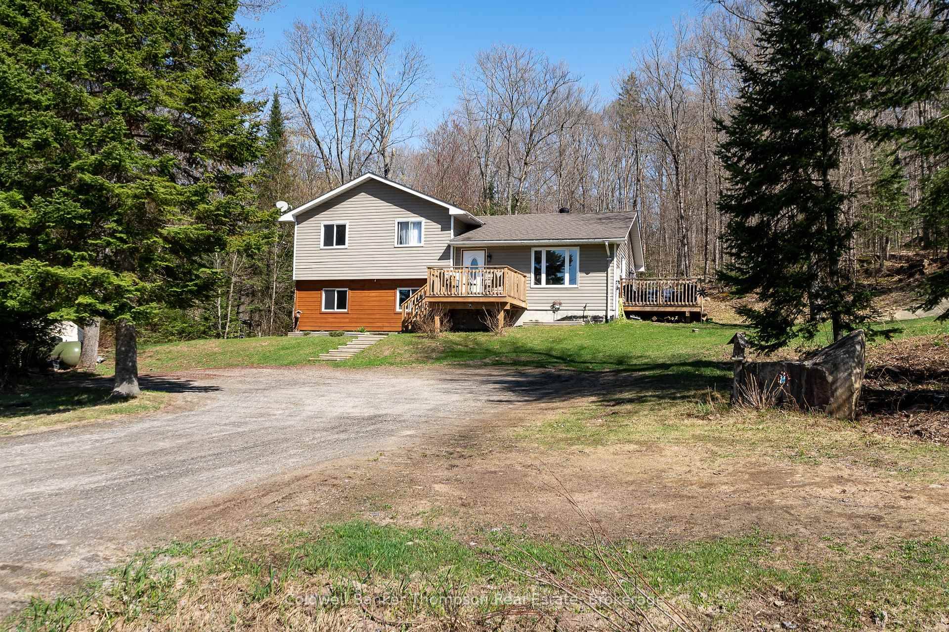 This inviting three bedroom side split, built in 2005, sits on nearly 2 acres of peaceful rural countryside and offers a blend of charm and potential.