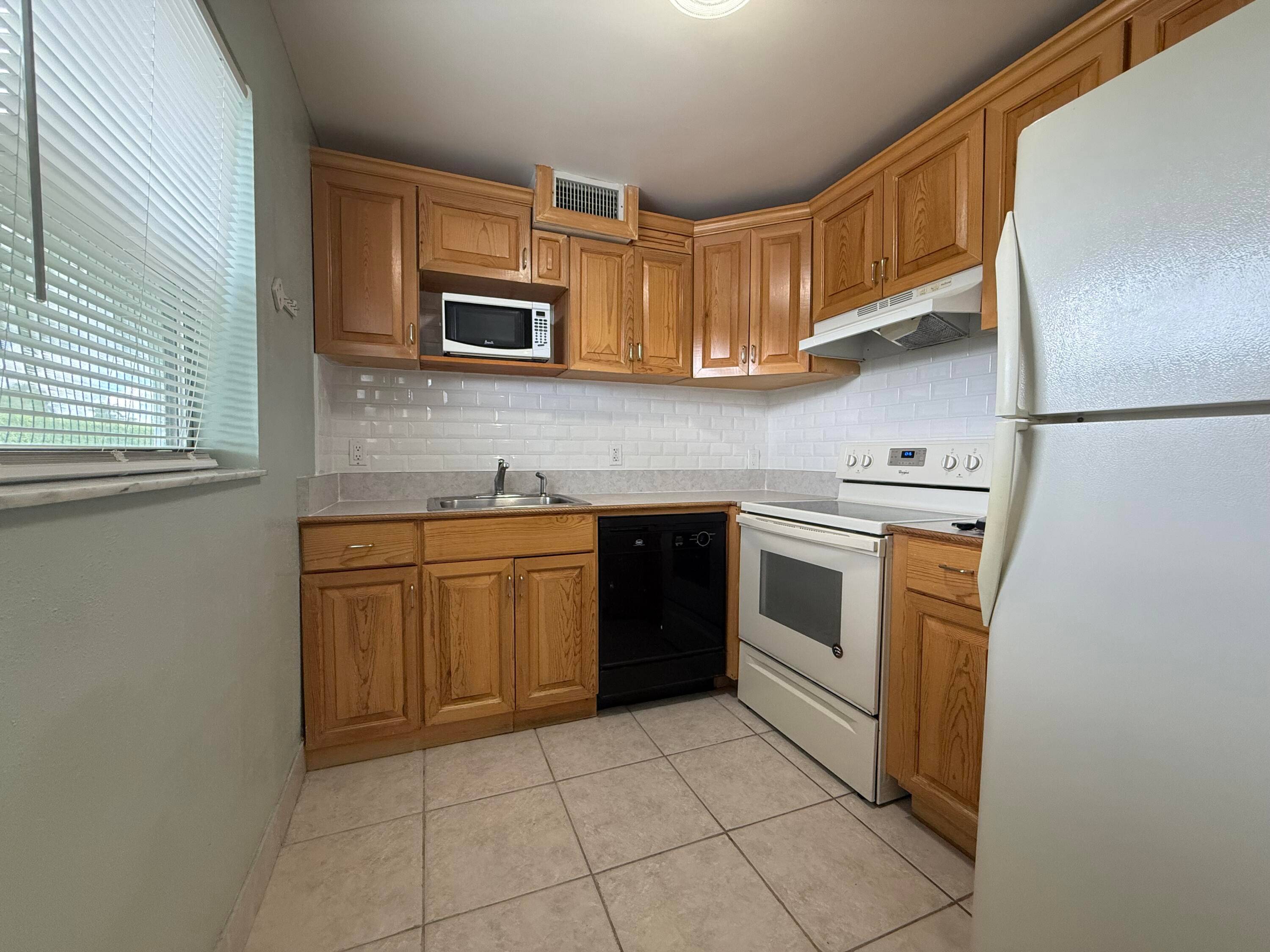 Ground floor 2 bedroom, 2 bath true corner unit with canal view from enclosed patio.