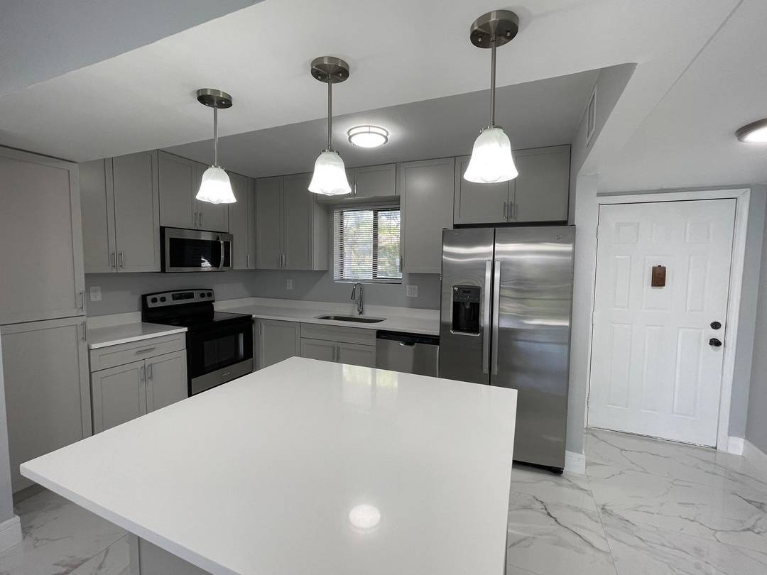 Spacious ground floor 4 bedroom, 2 bath home in a beautiful and quiet neighborhood just west of University Drive.