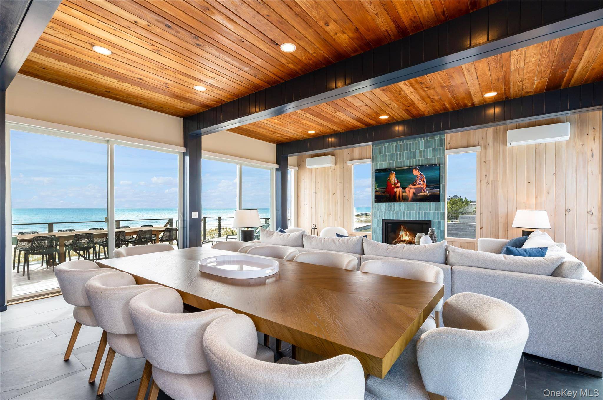 This fully renovated oceanfront estate offers a blend of modern luxury and coastal charm, featuring extensive upgrades and spacious indoor and outdoor living areas.