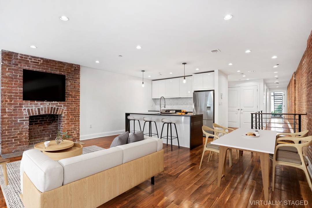 The largest 2 bedroom, 3 bathroom in Prime Harlem spanning through two full floors with Private Entrance, Recreation Room, Home Office, 2 Outdoor Spaces Private Garden and Rooftop.