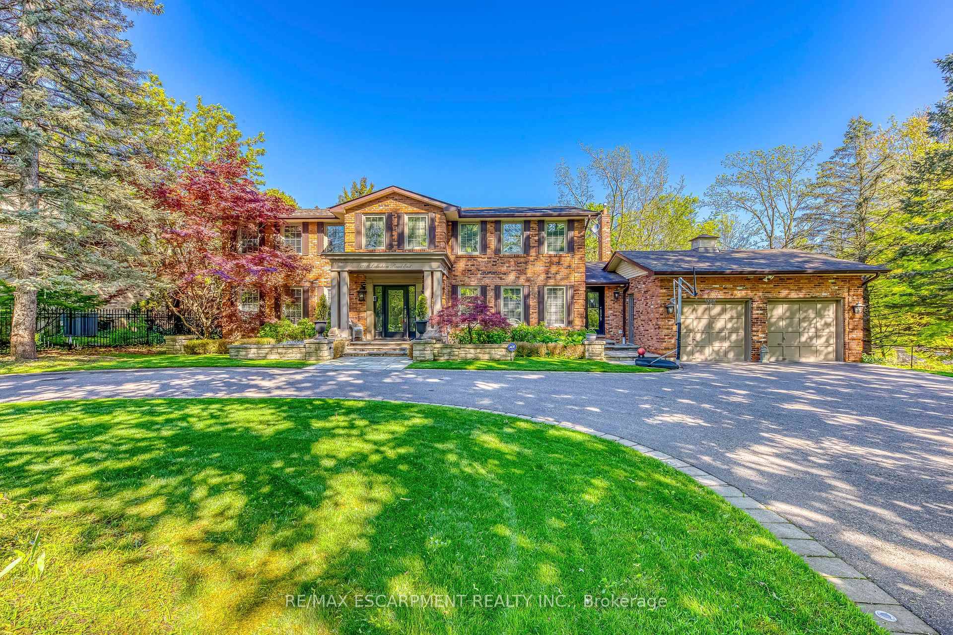 Classic 5 Bedroom, 5 Bathroom Home with 2 Full Kitchens in Oakville's Prestigious Morrison Area !