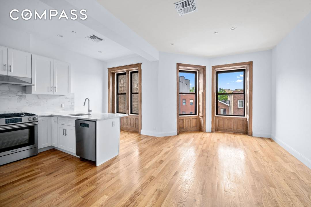 Welcome to 257 Throop Ave, a charming condo nestled within a classic Brooklyn limestone.