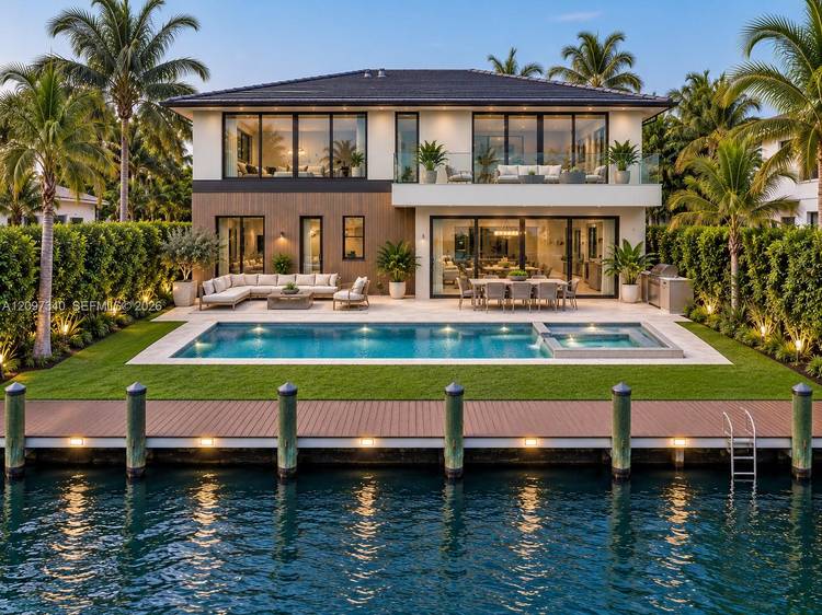A striking contemporary waterfront estate in the prestigious gated community of Keystone Point.